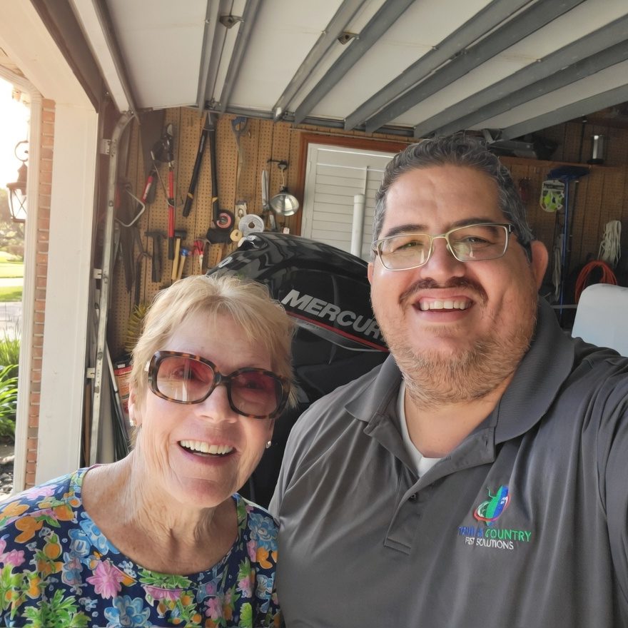 Edwin Cordova with a customer in her garage